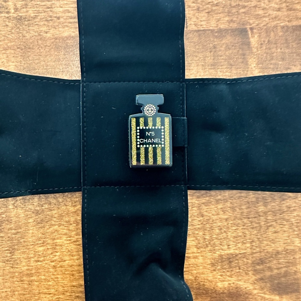 Brand new AUTHENTIC Chanel No 5 brooch. Never worn in original box
